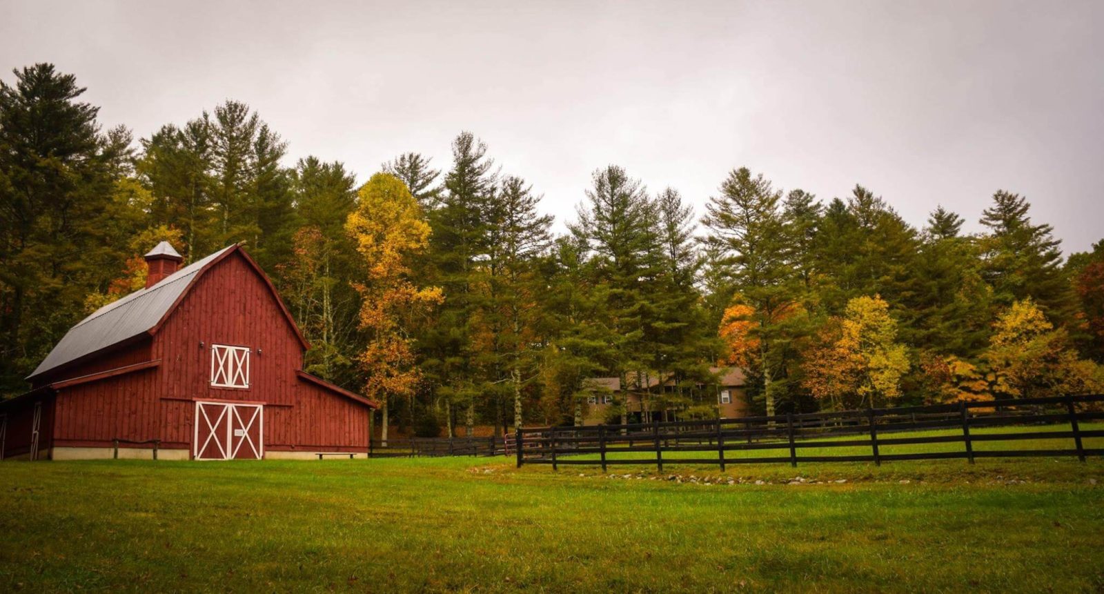 Red Barn With Black Fencing