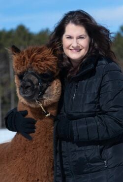Rebecca Gill Hugging Her Alpaca Nibbler