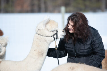 Rebecca Gill Talking to Alpaca Sherry Ann