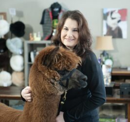 Rebecca Gill with Alpaca Nibbler Inside the Store