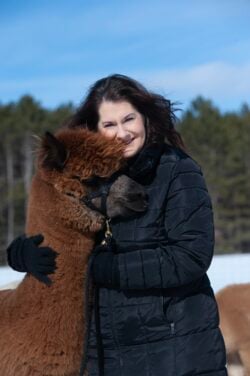 Rebecca Gill Hugging Her Alpaca Nibbler